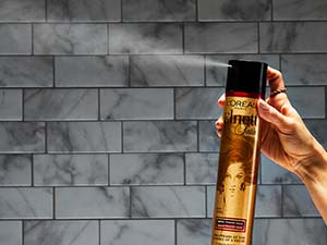 elnett hairspray being sprayed